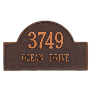 Whitehall Arch Marker two line standard wall mount plaque. The plaque has an arched shape and has copper lettering and a brown background