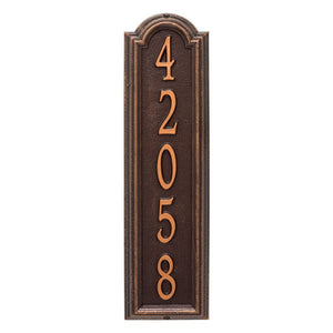 Whitehall Manchester vertical plaque. This plaque is rectangular is design with a small arch on top. This plaque has copper numbers and a brown background