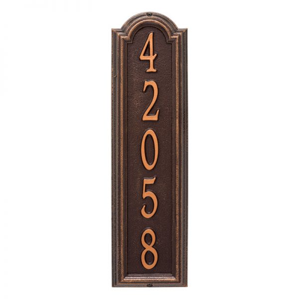 Whitehall Manchester vertical plaque. This plaque is rectangular is design with a small arch on top. This plaque has copper numbers and a brown background