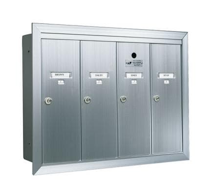 A Four vertical door silver anodized aluminum mailbox with name and number id card holders.