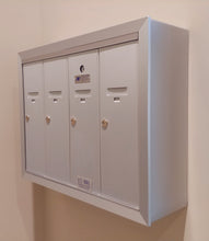 Load image into Gallery viewer, Surface mounted silver anodized aluminum vertical mailbox with four doors.
