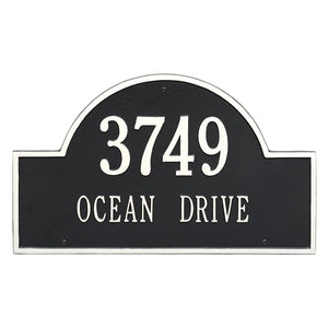 Whitehall Arch Marker two line estate wall mount plaque. The plaque has an arched shape and has white lettering and a black background.